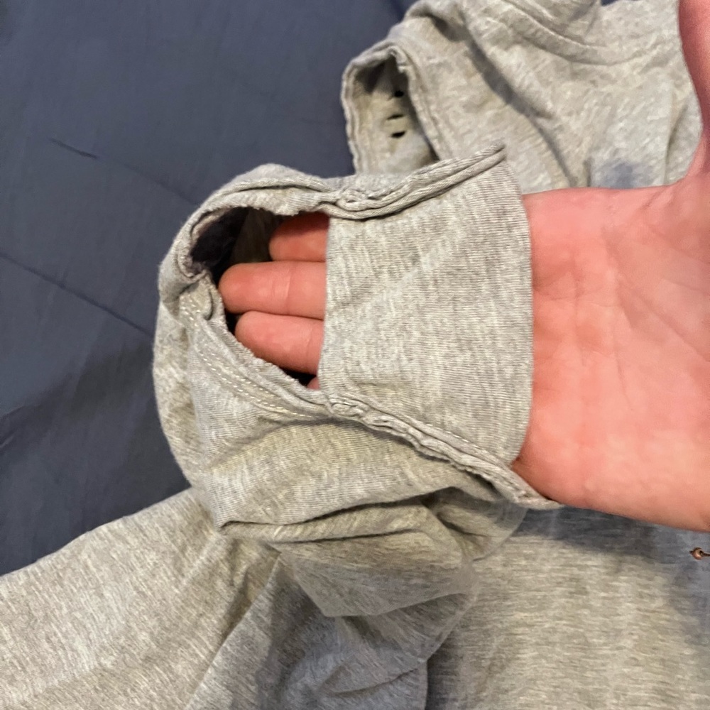 Lush grey tank top with holes. womens small. has bands on sides.